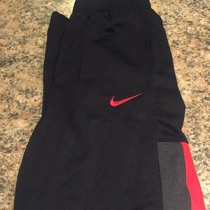 Boys Nike pants with grey and red stripe